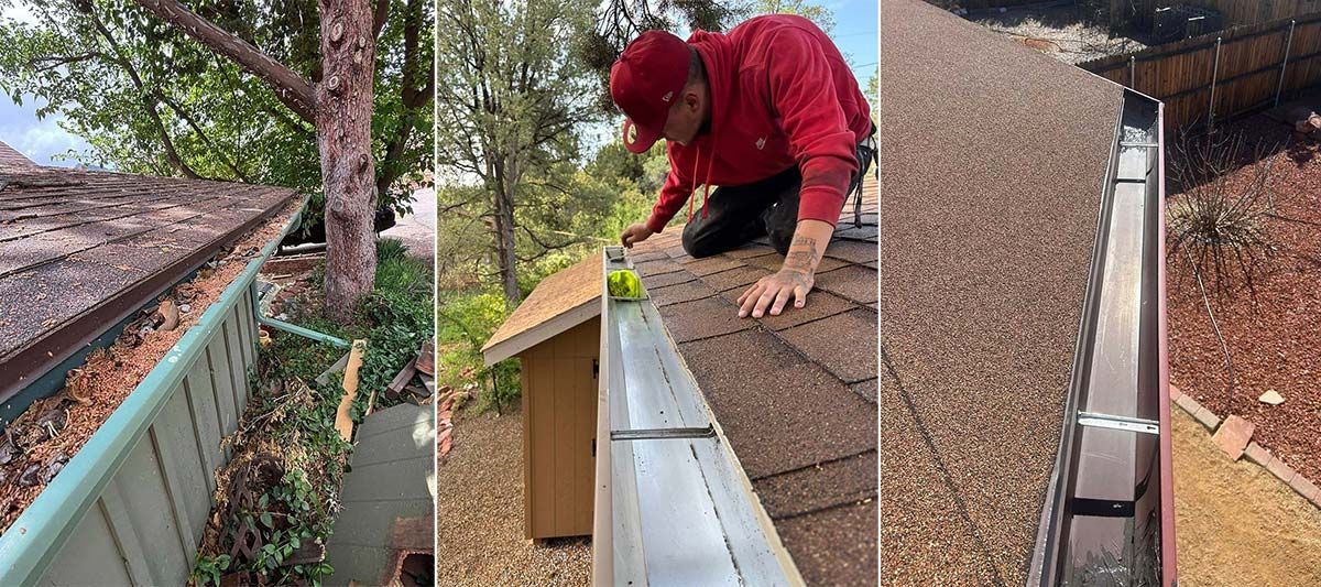 A person cleaning a roof gutter of debris; the setting is outdoors, with trees and a house.