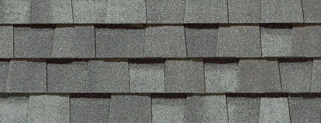Close-up of gray asphalt roof shingles.