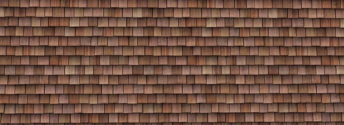 Brown wooden cedar shake shingles arranged in horizontal rows.