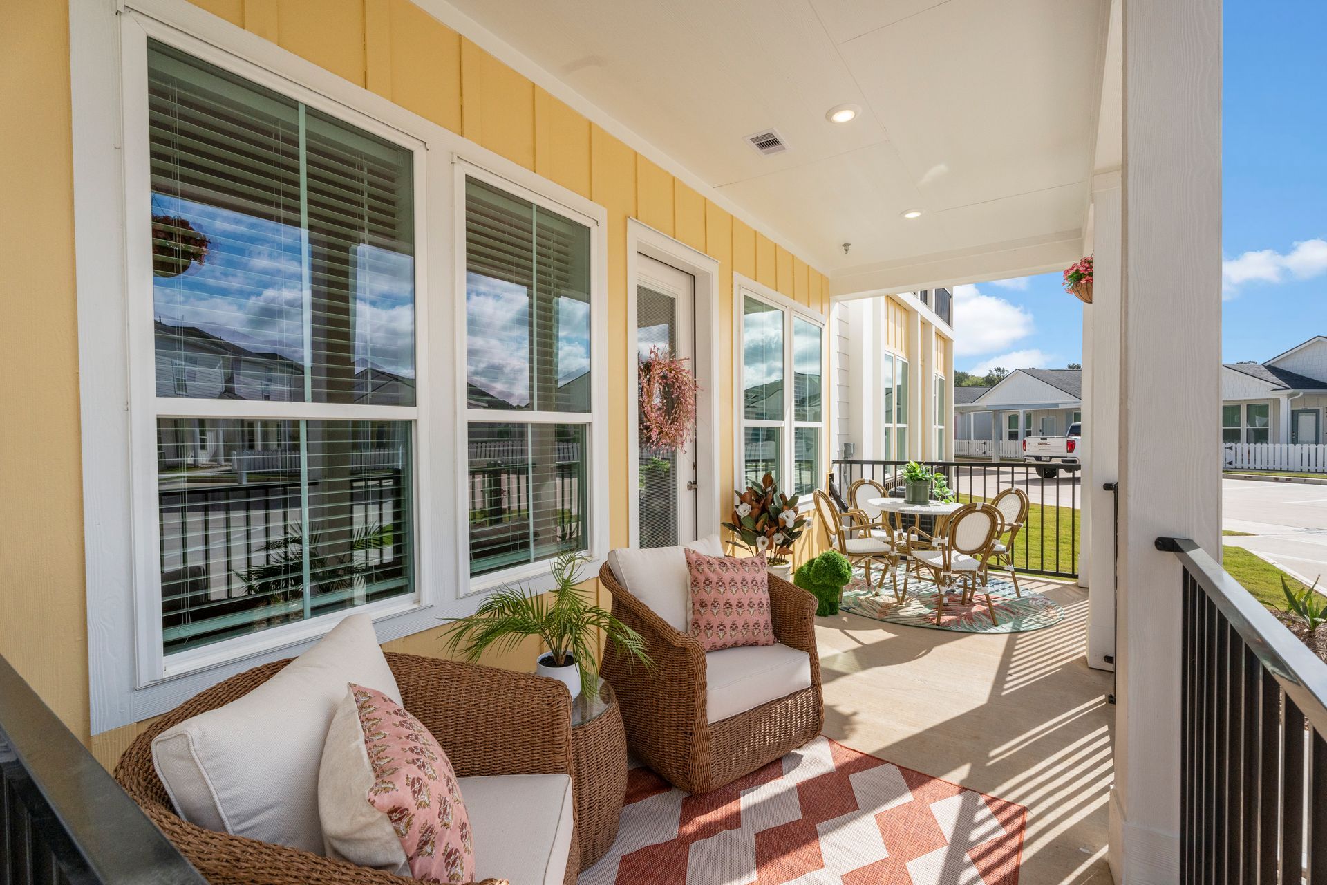 Covered porch at a cottage-style home at Boardwalk Village in Conroe, TX