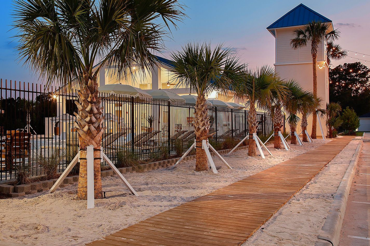 Boardwalk Village community entrance at sunset