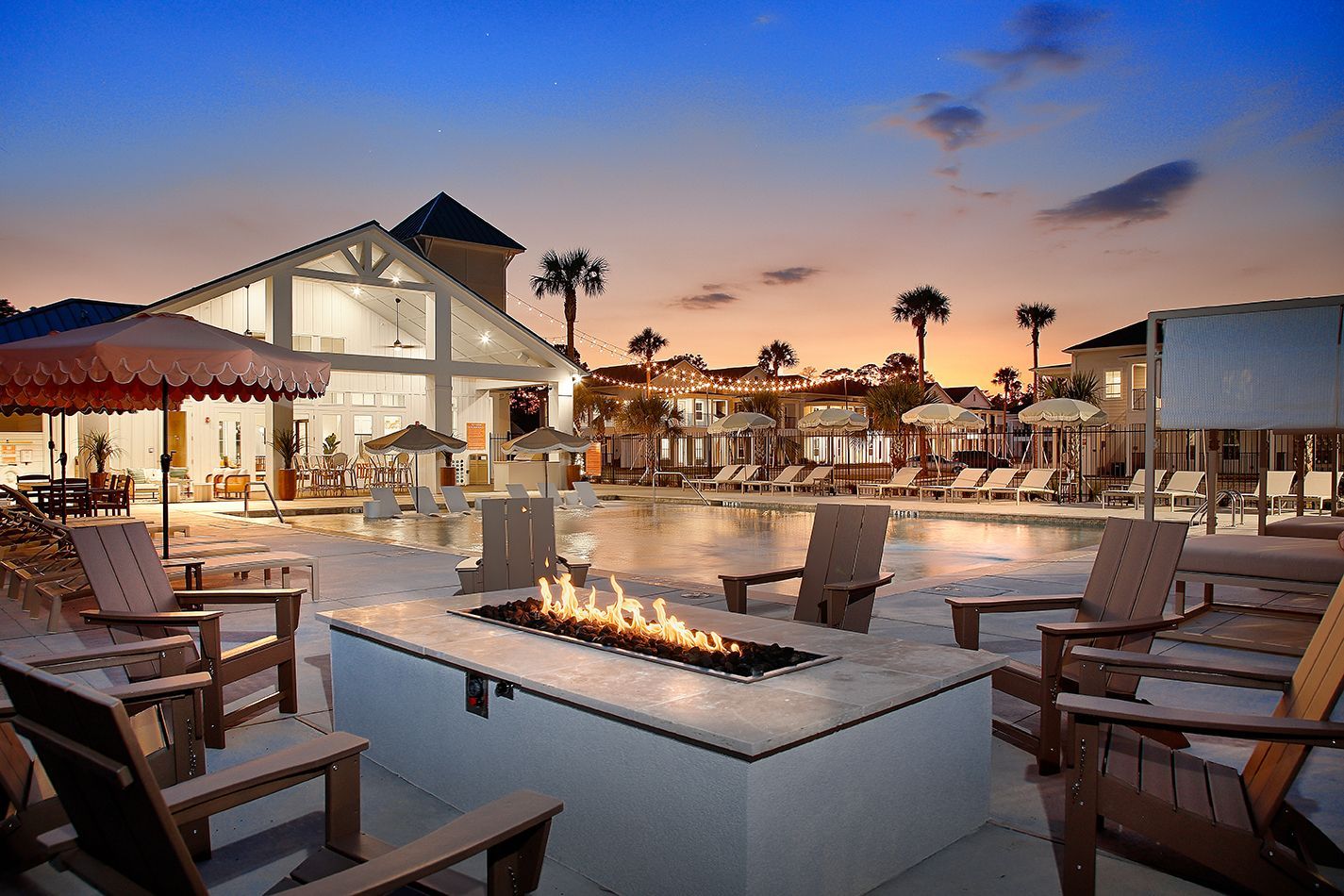 Resort-style pool and outdoor fire pit at Boardwalk Village in Conroe, TX