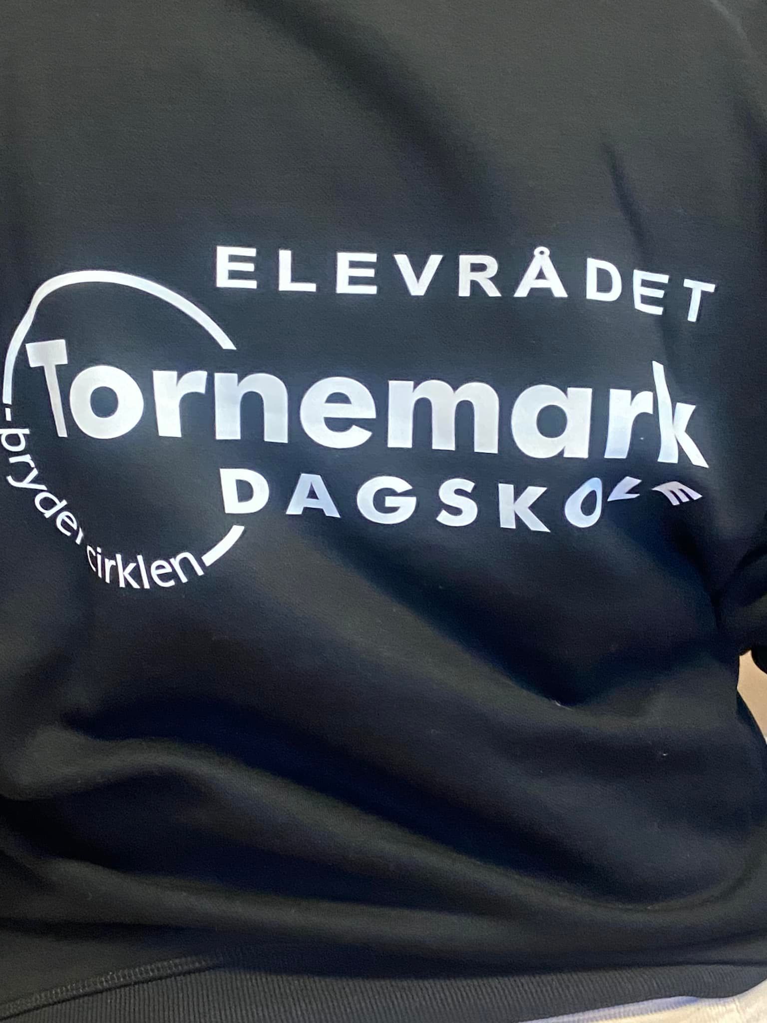 Black sweatshirt with white text: 
