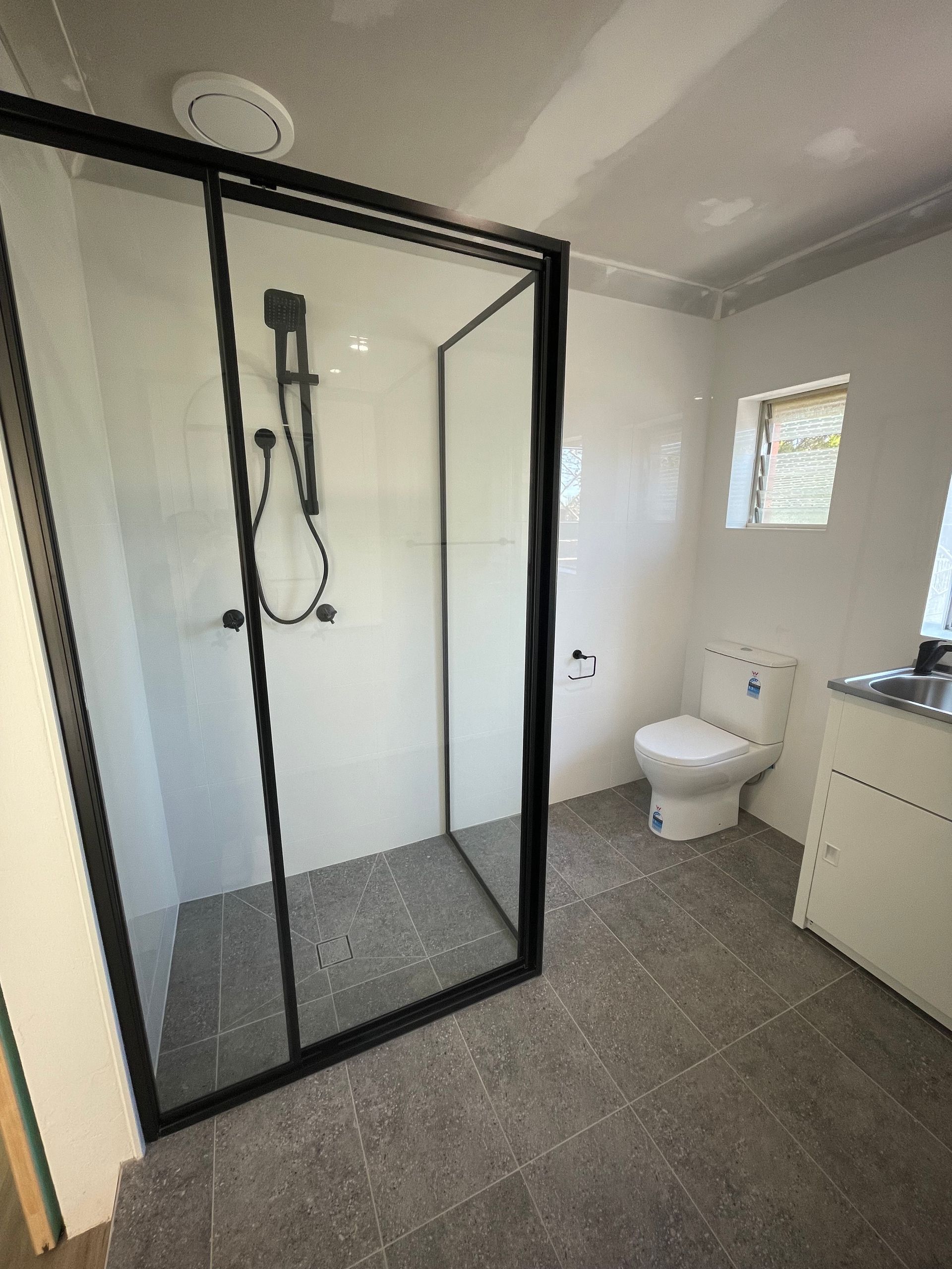 Copper Pipes Installed Against a Tiled Wall, With Various Valves and Fittings — B&A Plumbing and Gas In Wauchope, NSW