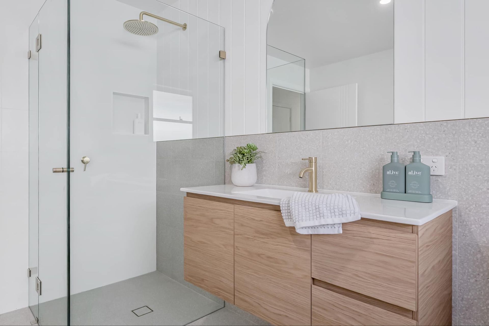 White Bathroom With Two Sinks, Toilet, Window, and Built-in Shelving — B&A Plumbing and Gas In Wauchope, NSW