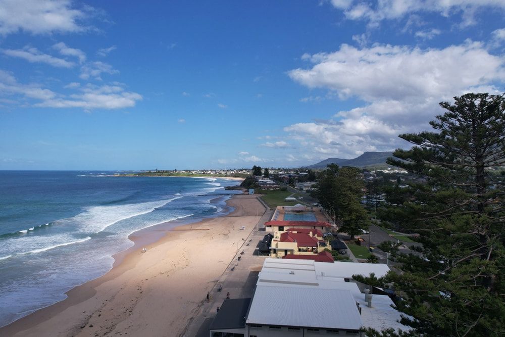 An Aerial View of A Beach on A Sunny Day — Illawarra Resurfacing Pty Ltd in Thirroul, NSW