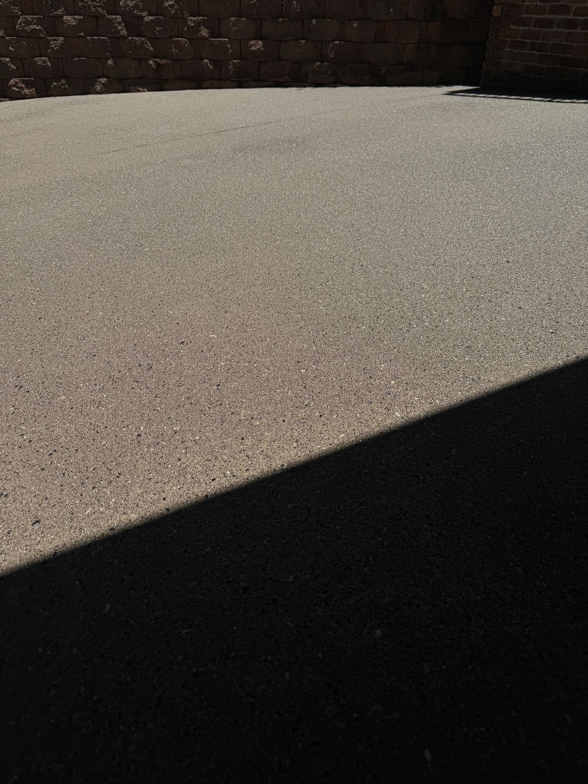 A Concrete Driveway in Front of A House — Illawarra Resurfacing Pty Ltd in Balgownie, NSW
