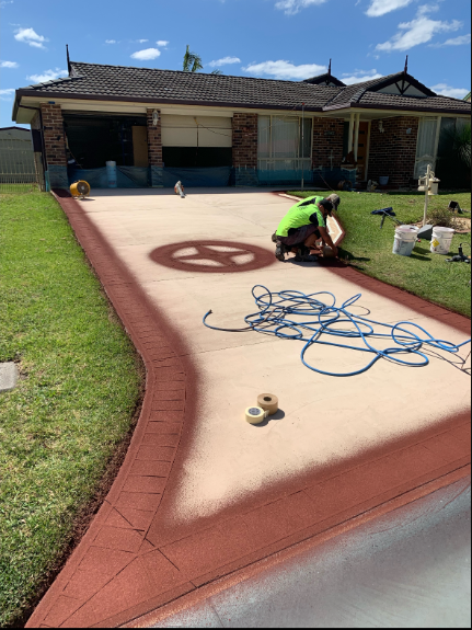 A White Suv Is Parked in A Driveway Next to A House — Illawarra Resurfacing Pty Ltd in Balgownie, NSW