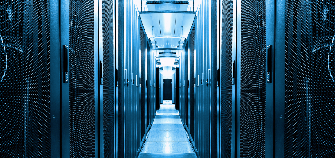 Rows of server racks in a data center, bathed in cool blue light.
