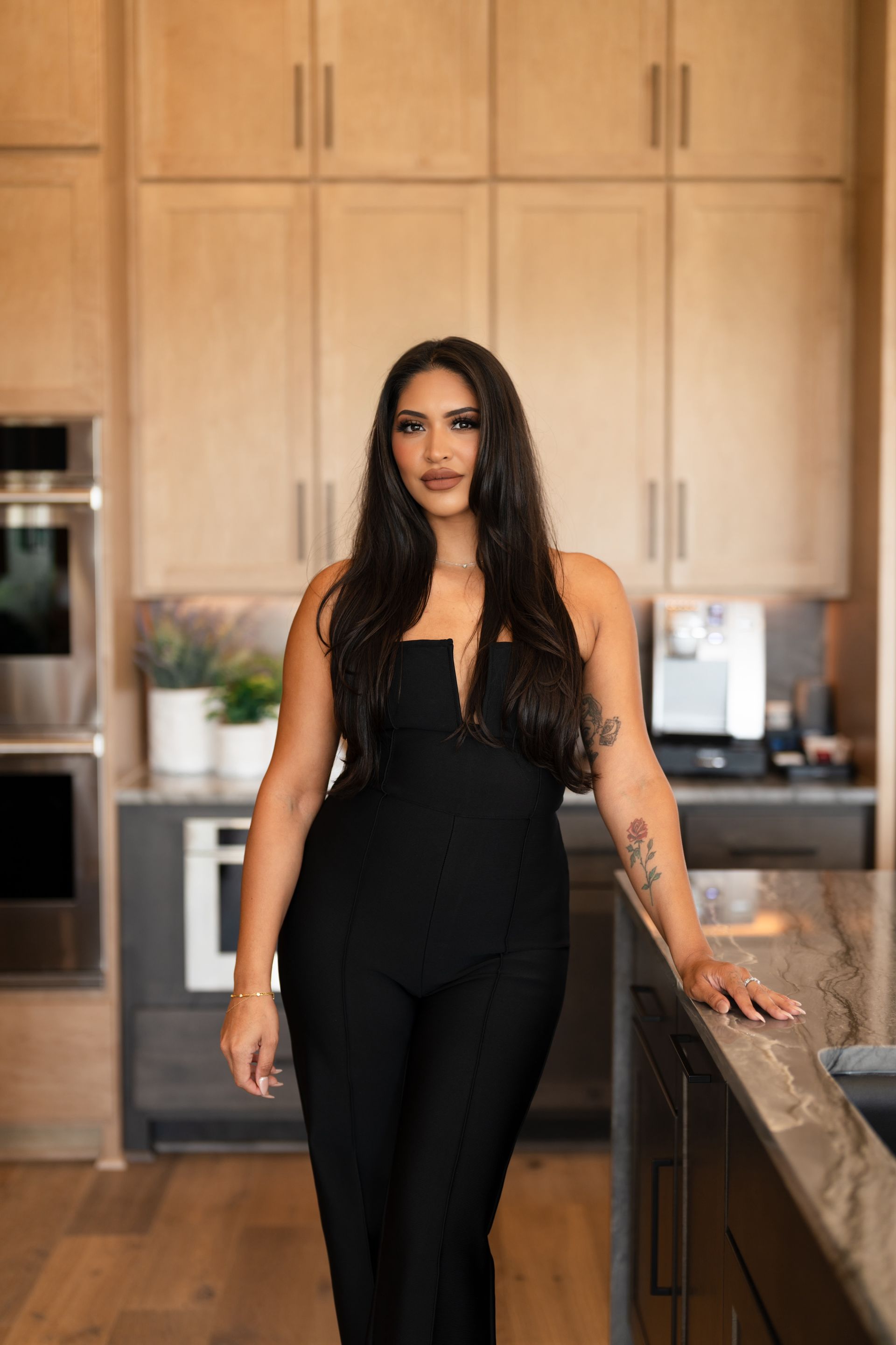 Vanessa Bouchoucha, Among San Antonio's Top Realtors.  Posing in beautifully crafted kitchen.