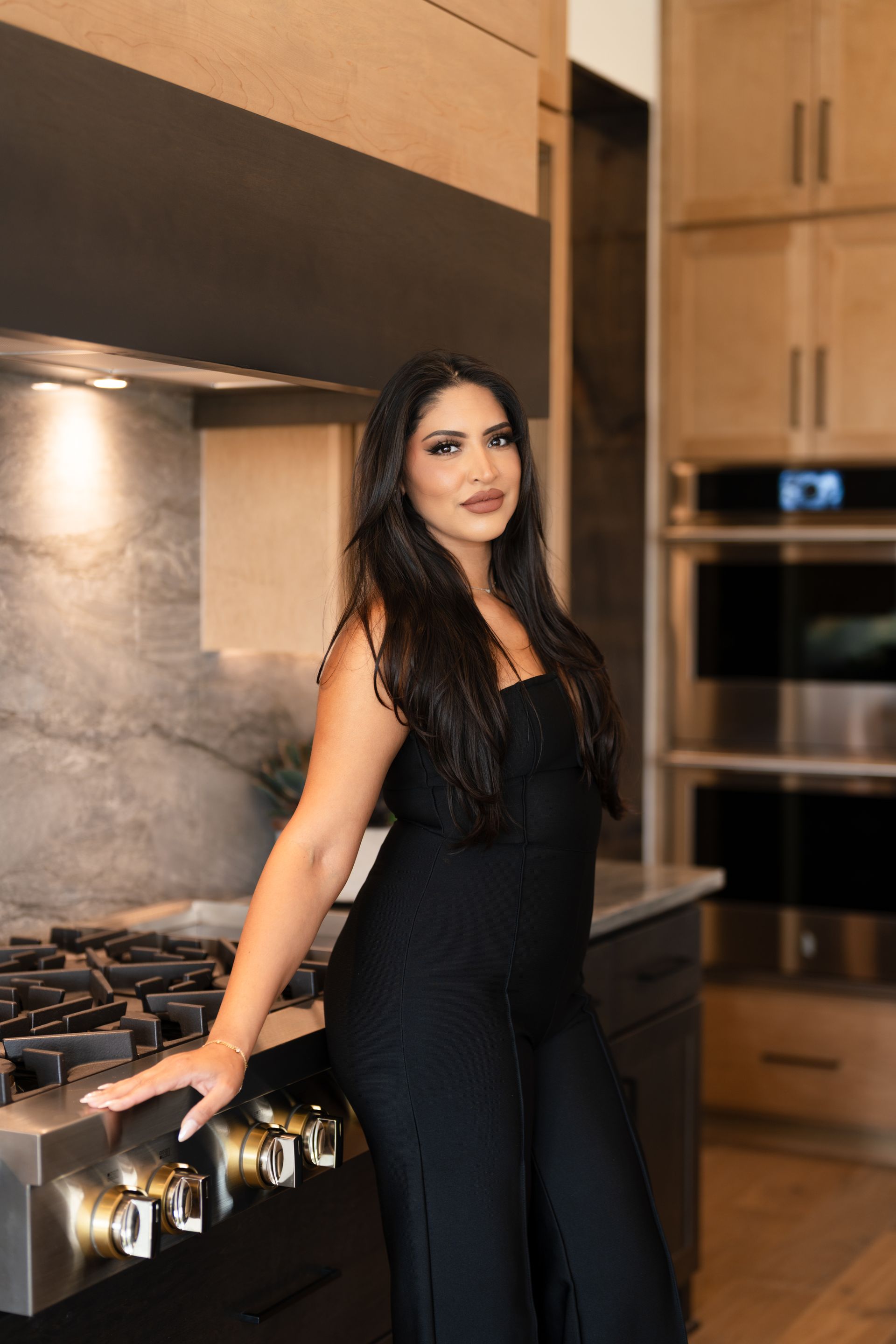 Vanessa Bouchoucha, Texas' most trusted Realtor.  Posing in luxury home kitchen.