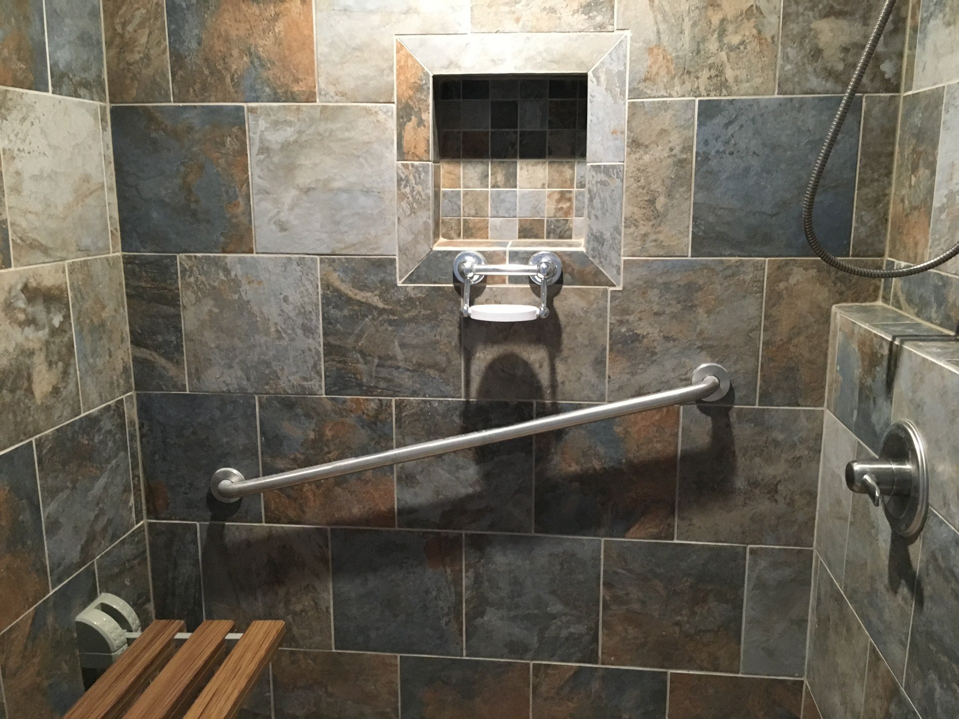 Tile and handicap grab bar installed