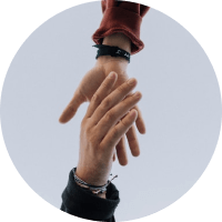 Two hands reaching toward each other against a light gray circular background