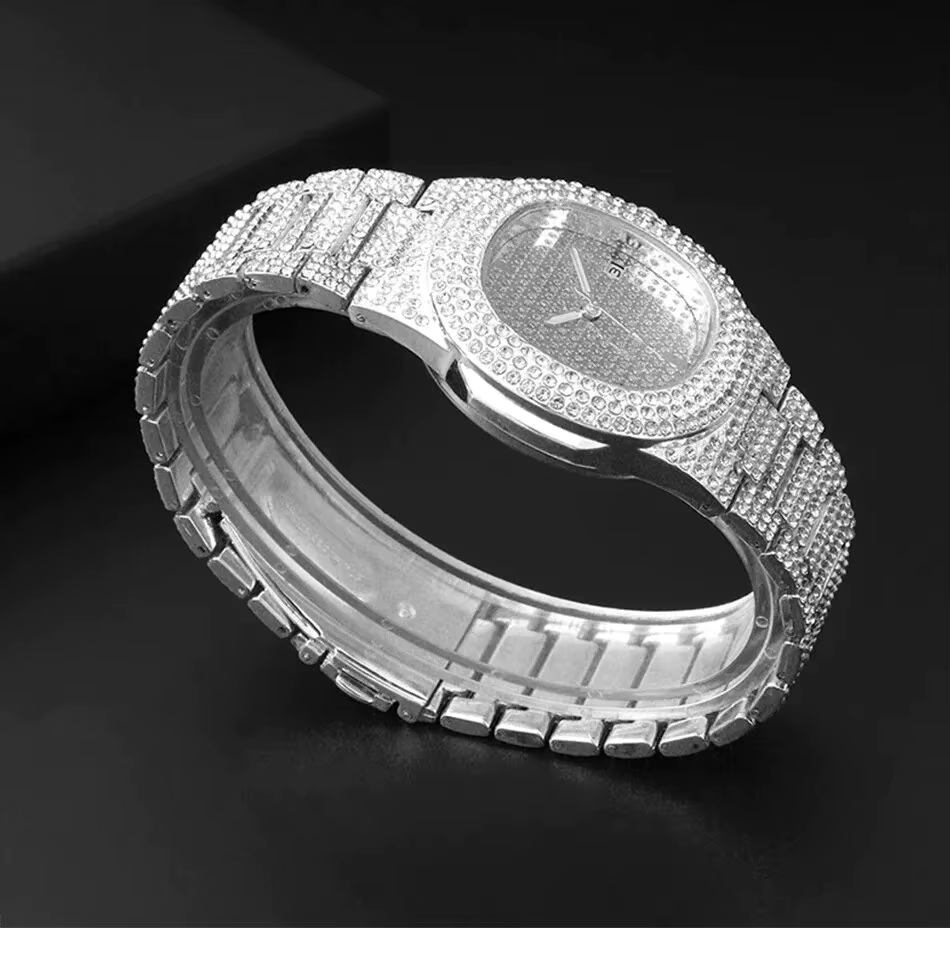 Diamond-studded silver wristwatch on a black display cushion