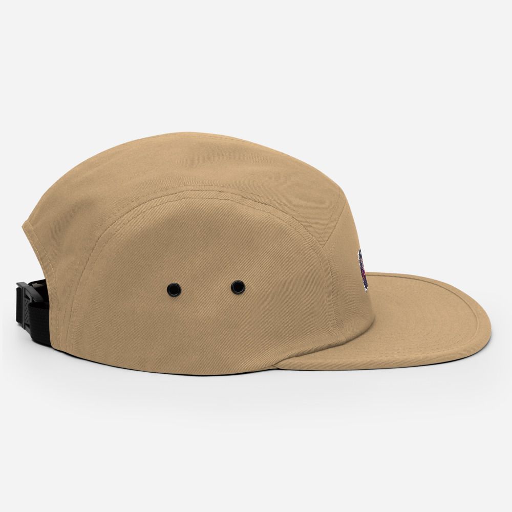 Tan baseball cap with a small embroidered patch on the front and a flat brim