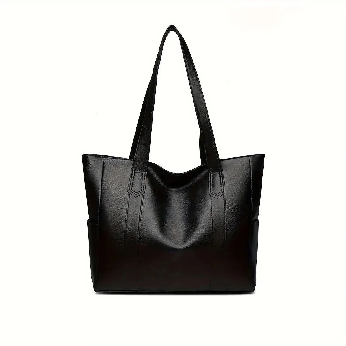 Black leather tote bag with long handles on a white background