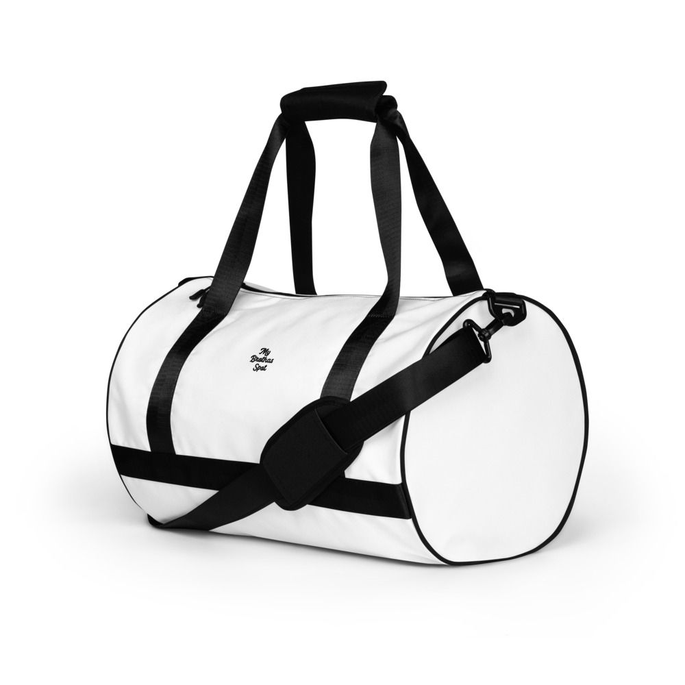White and black duffel bag with long shoulder straps and zipper accents