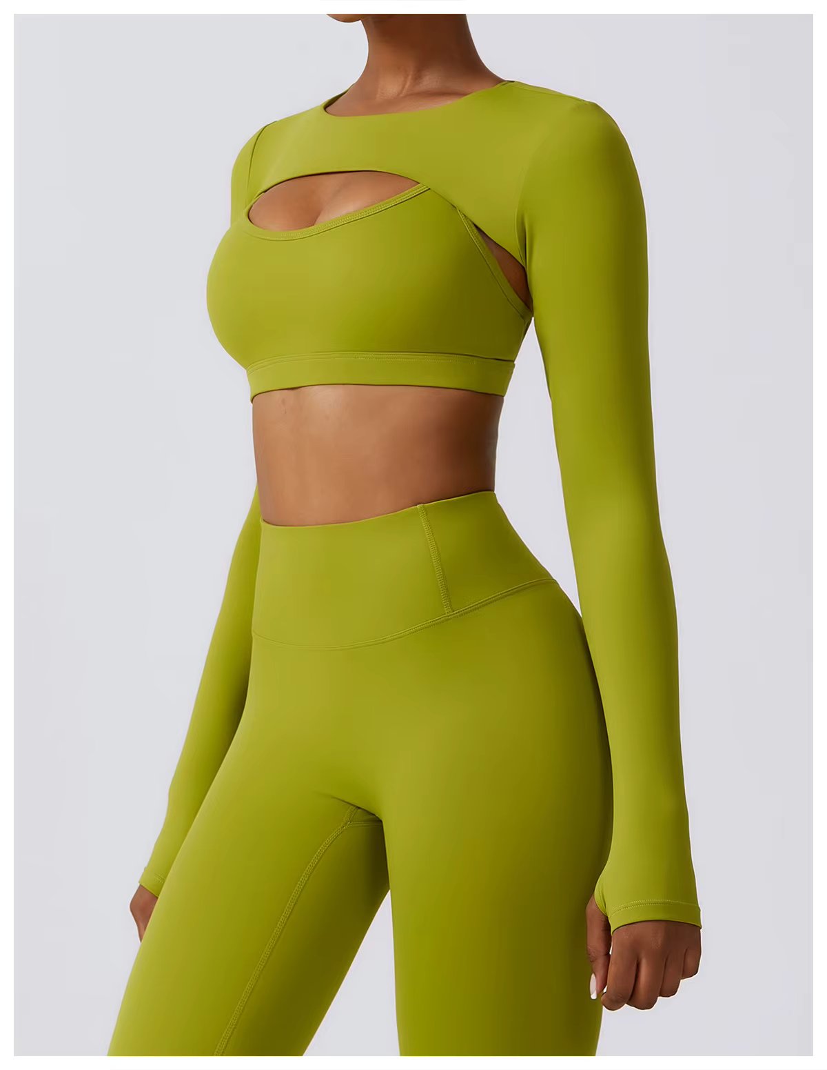 Lime-green long-sleeve athletic crop top and matching high-waist leggings on a model
