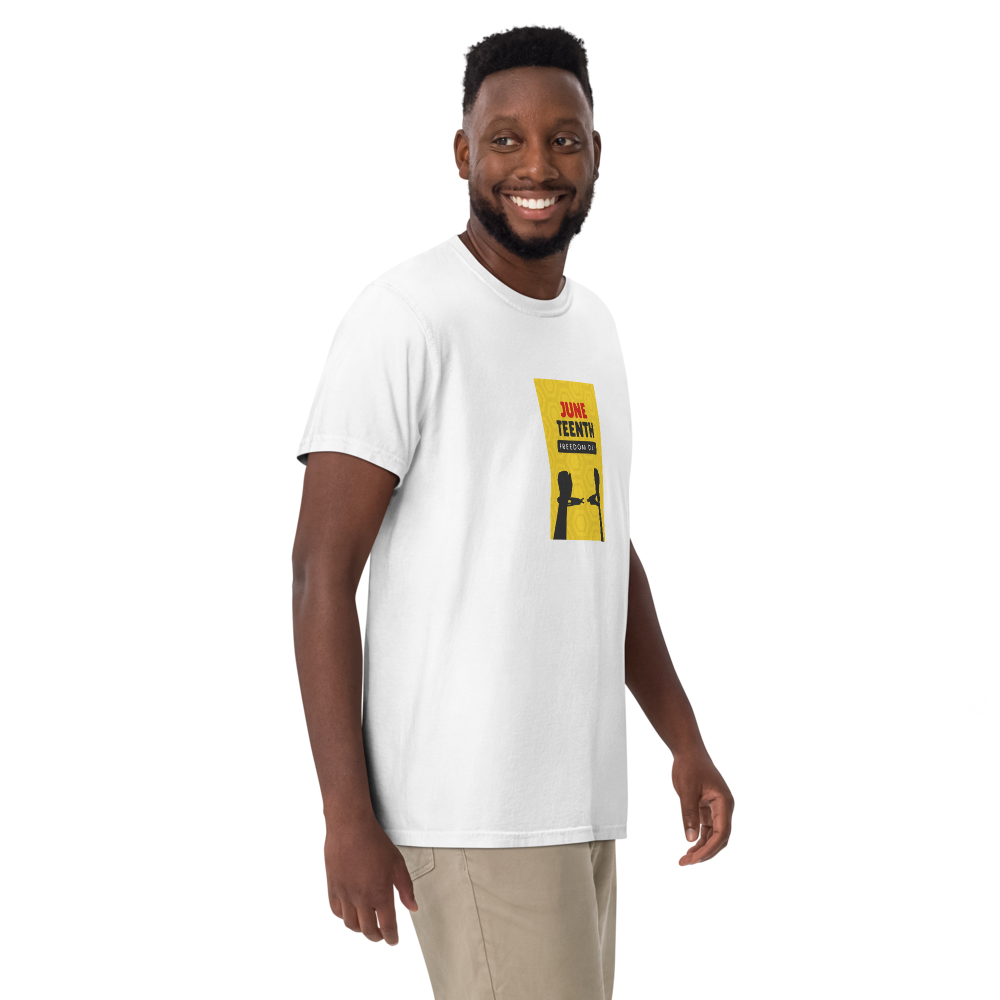 Man wearing a white T-shirt with a yellow graphic, standing and smiling on a white background