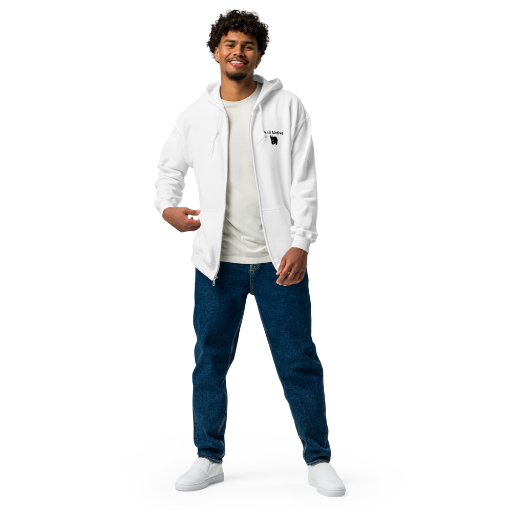 Man in a white hoodie and T-shirt, posing against a plain background.