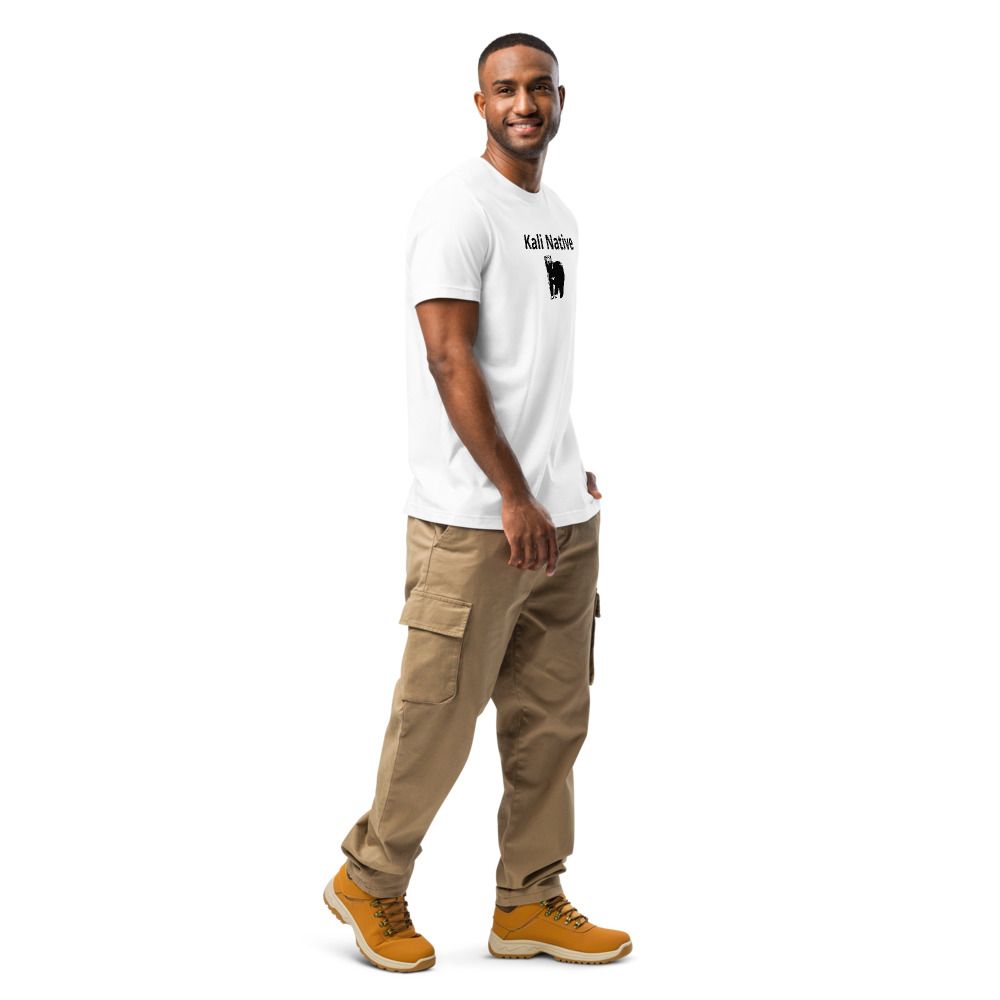 Smiling man in a white T-shirt with “Kali Native” text and a black bear graphic on the front