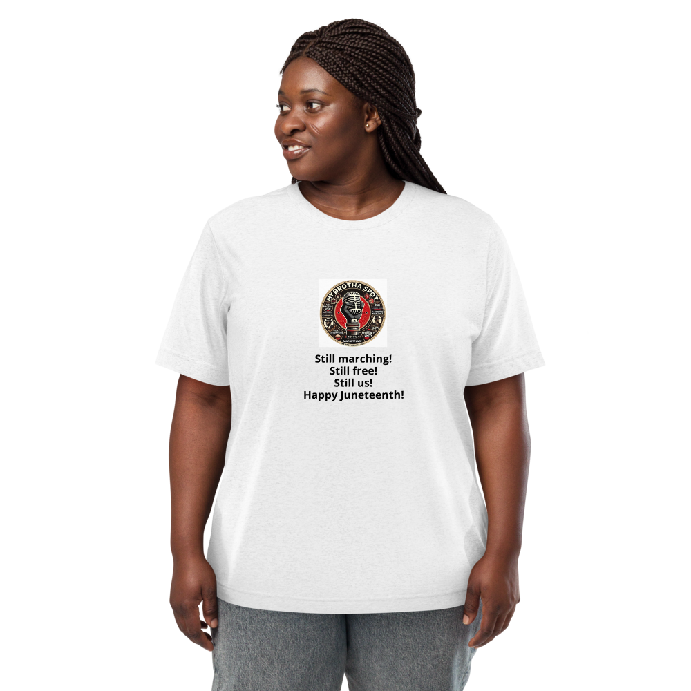 Woman wearing a white graphic T-shirt and black leggings, standing against a plain white background.