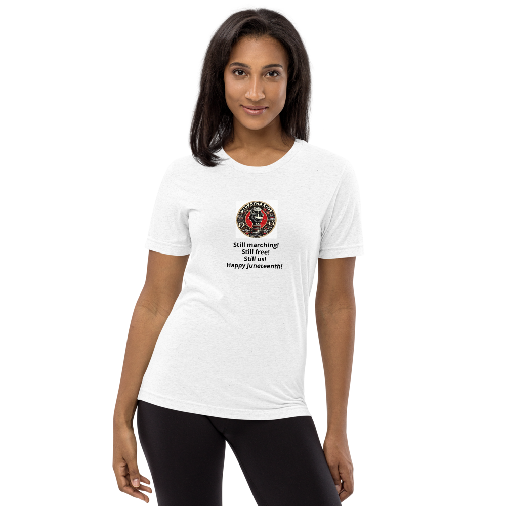 Woman wearing a white graphic T-shirt and black leggings, standing against a plain white background.
