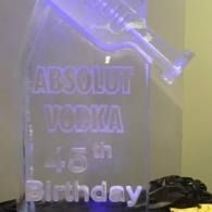 Lit Absolut Vodka 45th Birthday sign with purple lighting