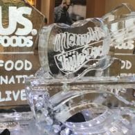 Clear acrylic ice sculptured sign with white lettering in a retail display