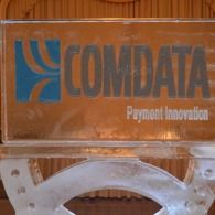 COMDATA logo and “Payment Innovation” on an orange sign with a blue emblem