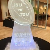 White trophy reading “JSU vs TSU” and “Southern Heritage Classic” in a lobby setting