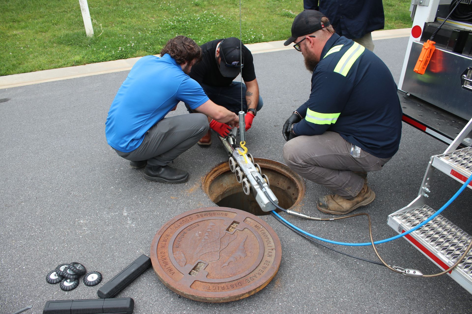 Chonzie Inc workers using a CCTV robot 