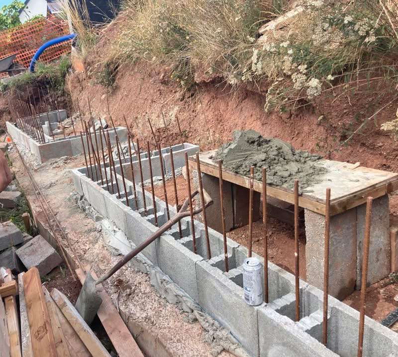Block wall build block wall build with reinforced bars for strength outside with bush