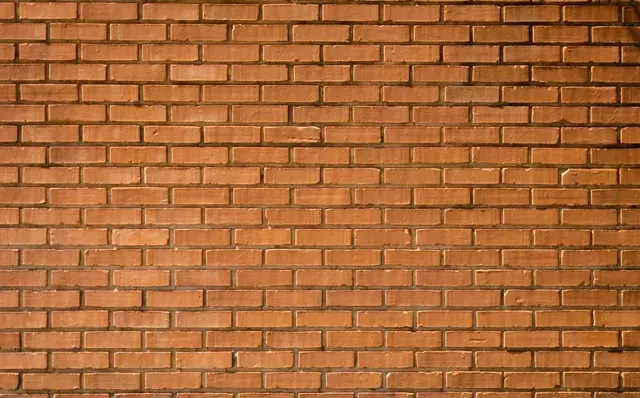 A close up of a brown brick wall