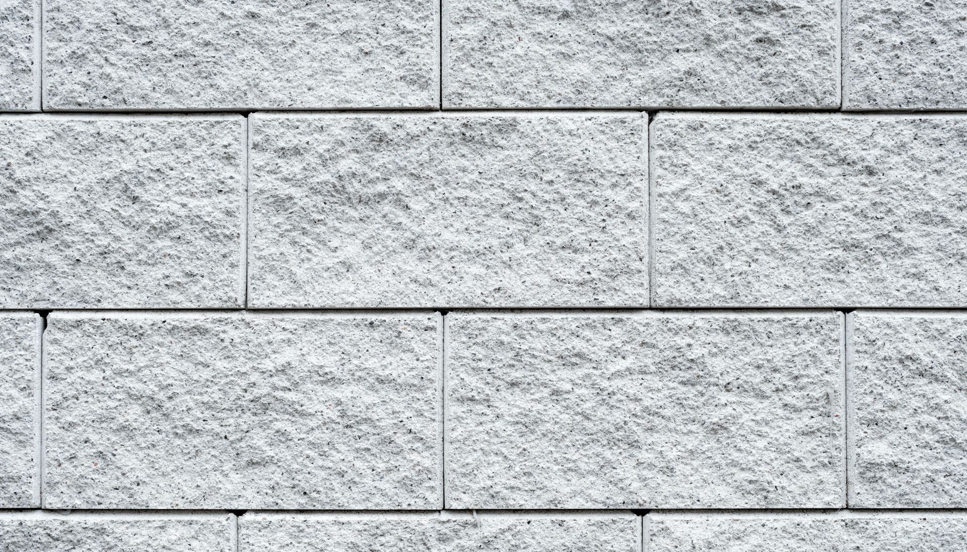 A close up of a gray brick wall.