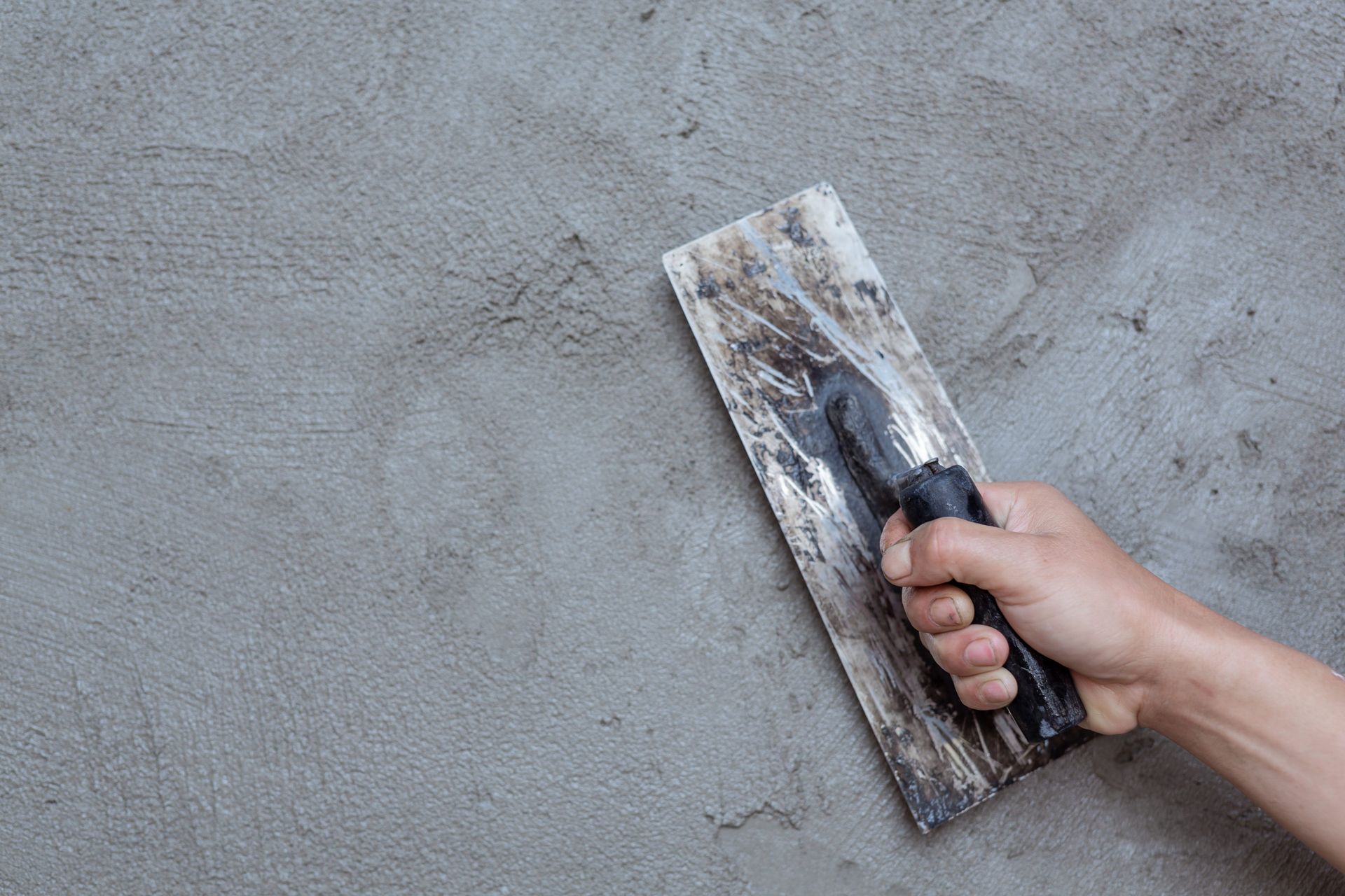 plastering a wall with trowl