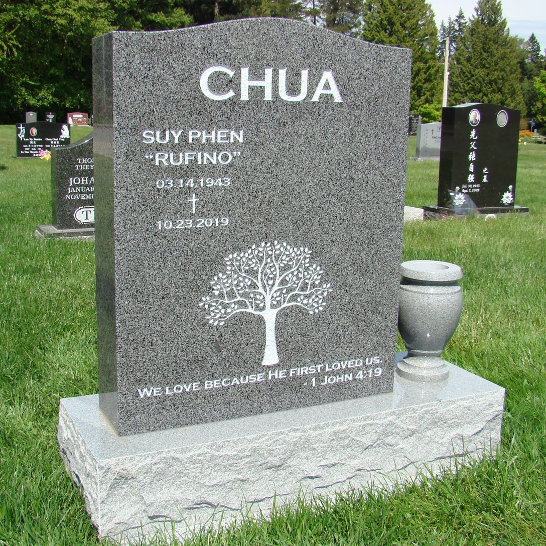 a gravestone for chua is in a cemetery