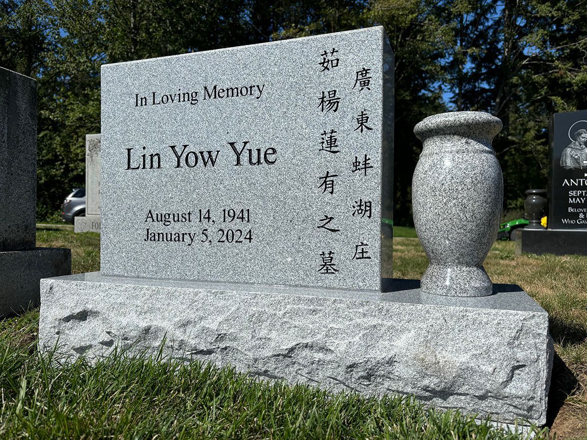 18x24 all polished sera grey granite memorial upright with matching vase and base.
