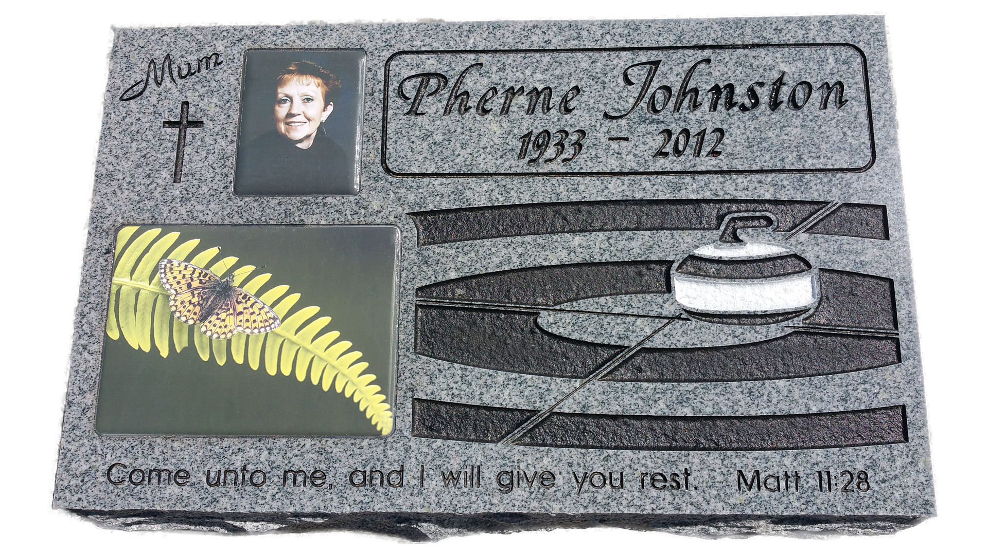 A gravestone with a picture of a woman and a fern on it
