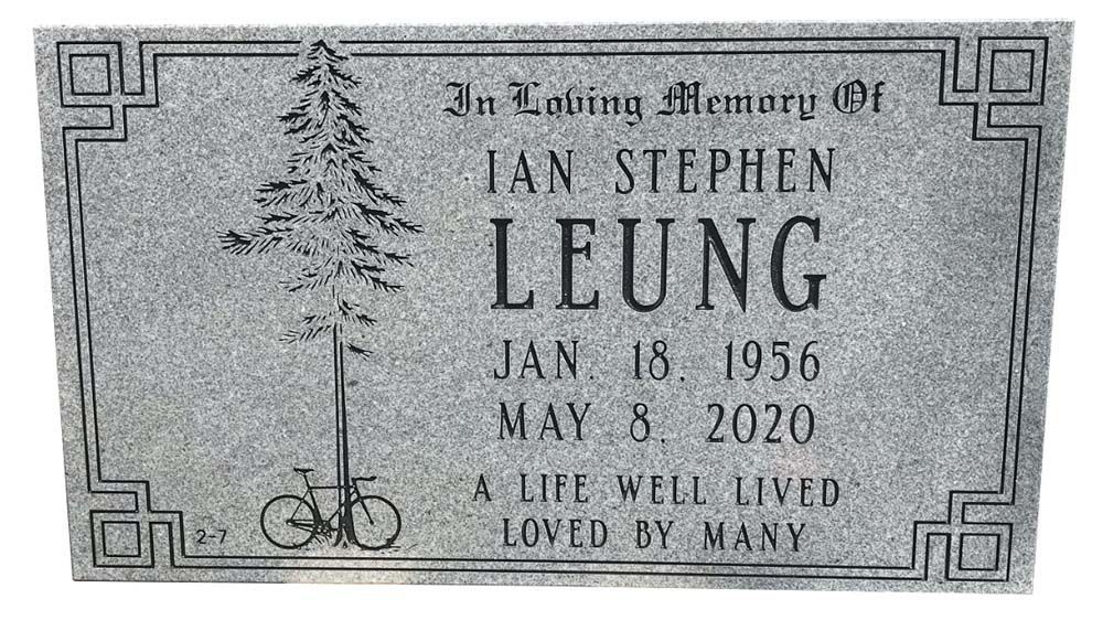 A gravestone for stephen leung with a tree and bicycle on it.