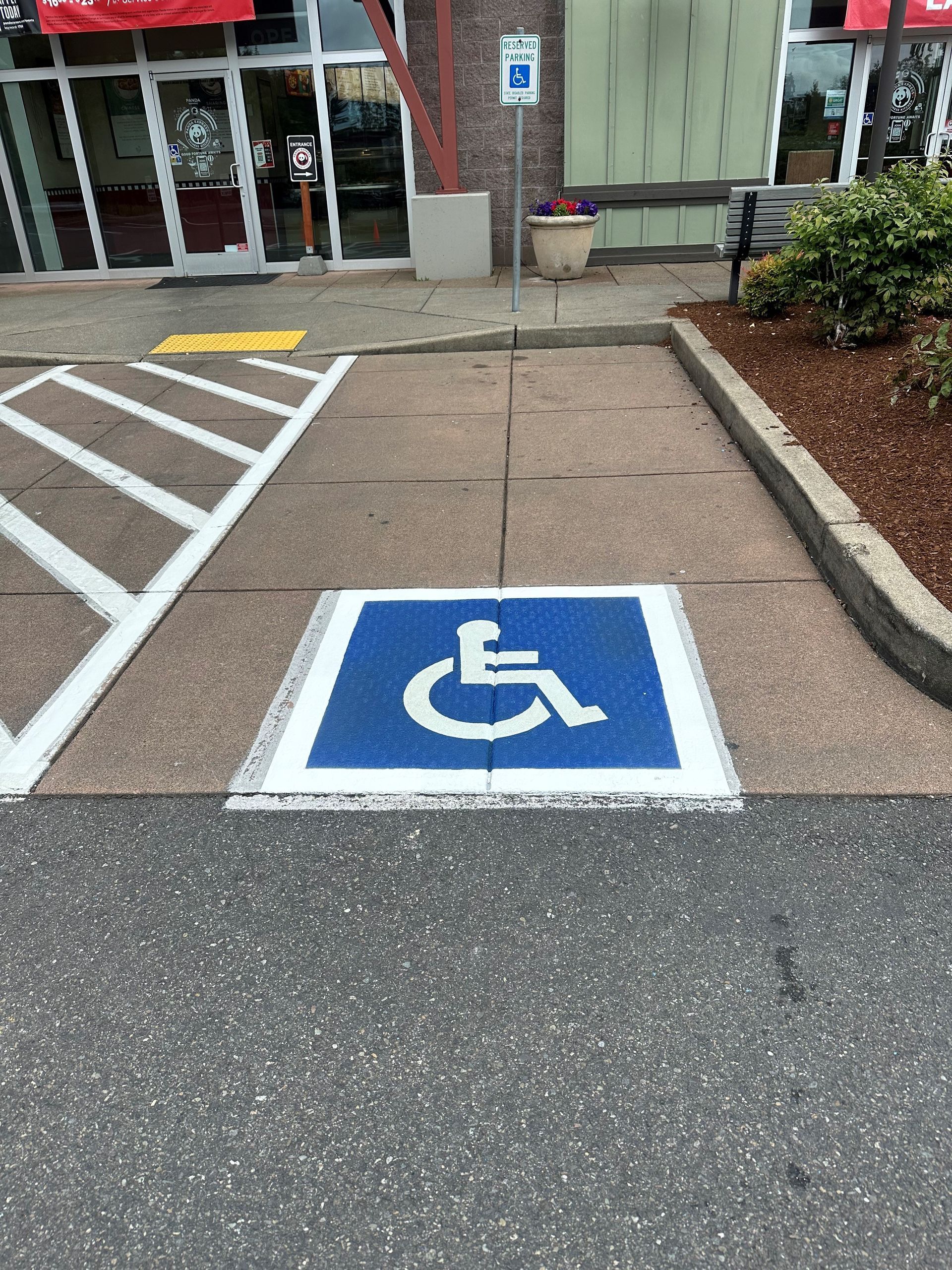 A close up of a parking lot with yellow lines