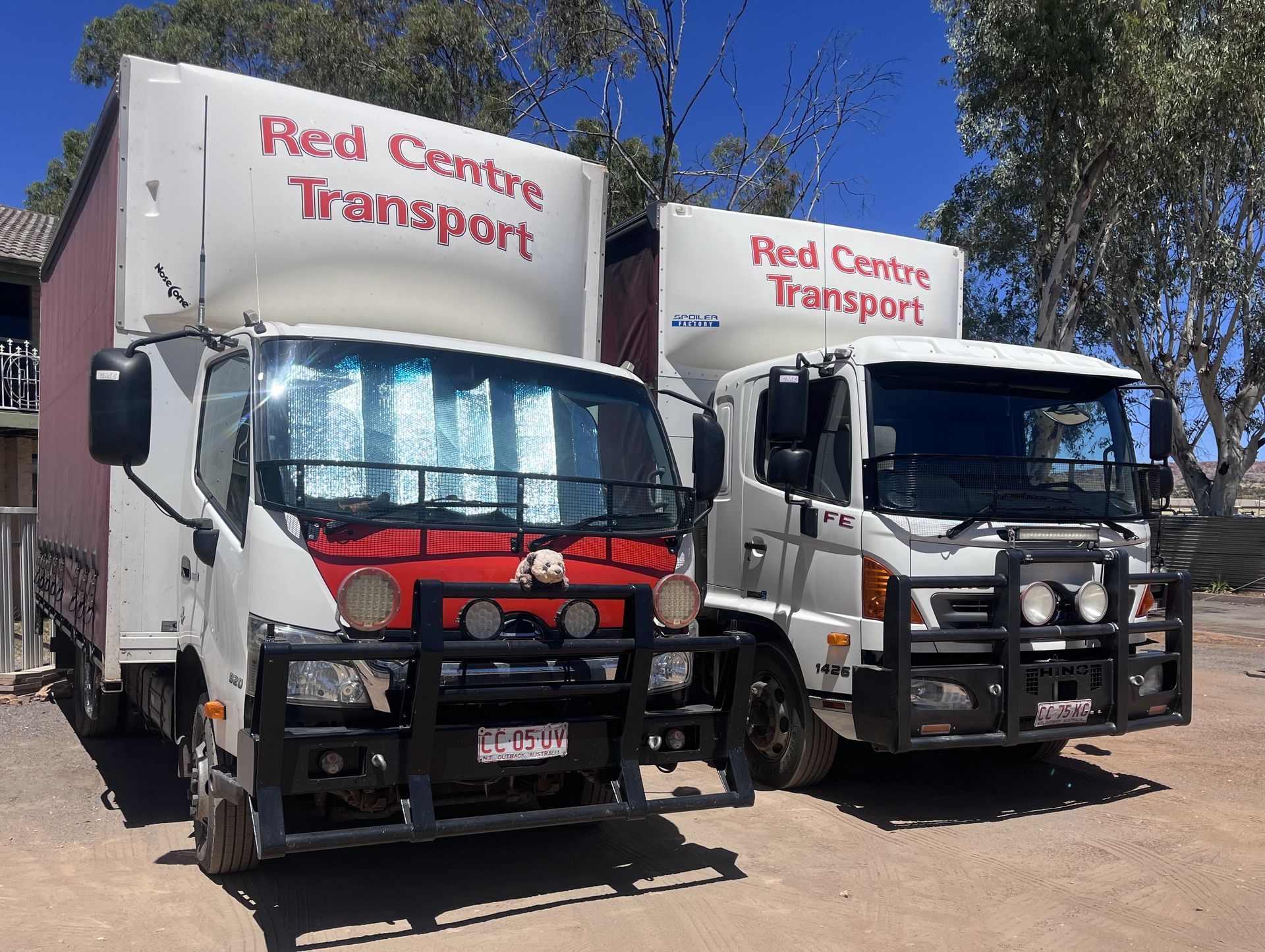 Delivery Person Scanning a Box Next to a Van — Red Centre Transport in Braitling, NT
