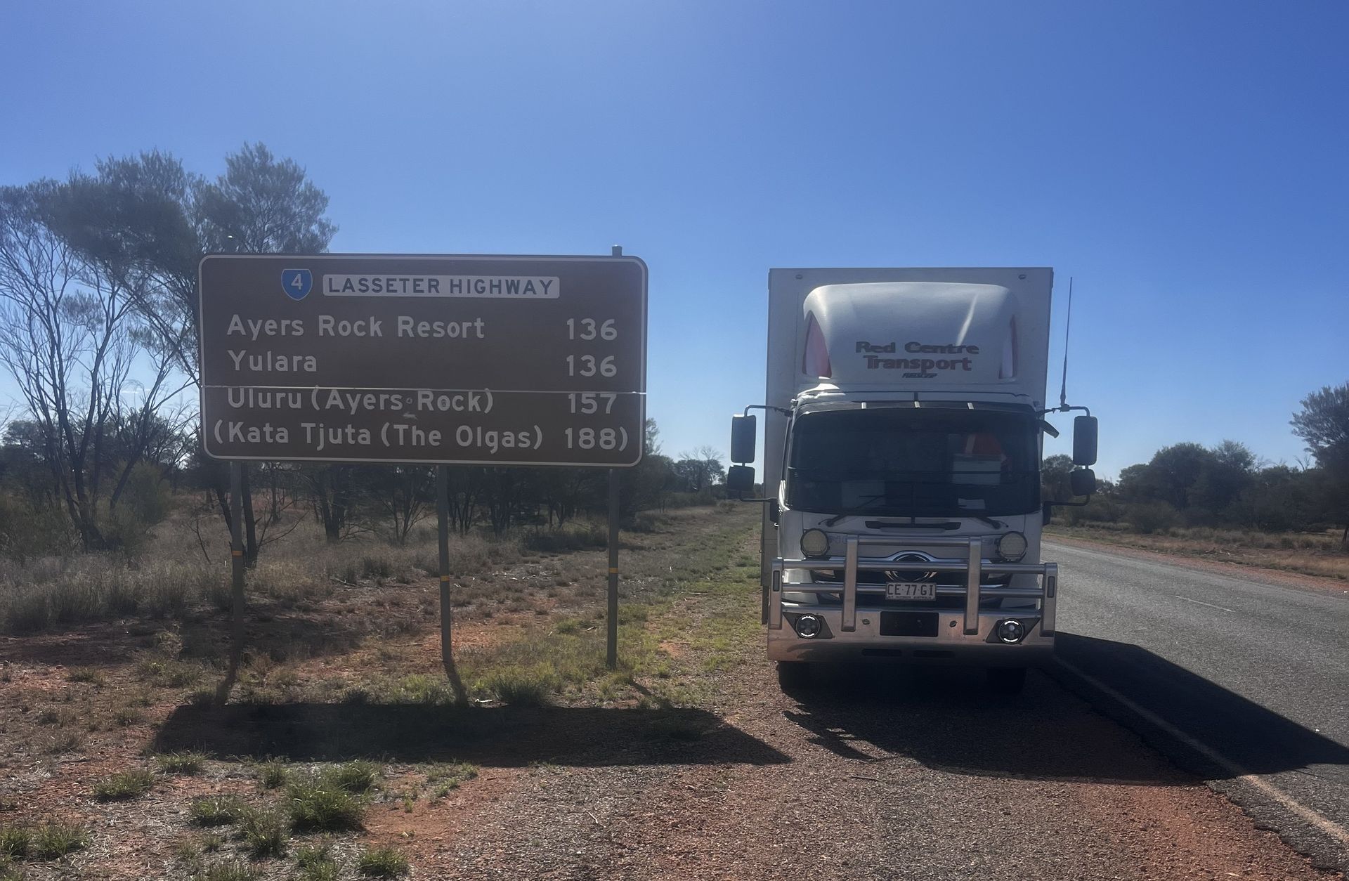 White Delivery Van Driving on a Road at Sunset โ Red Centre Transport in Braitling, NT