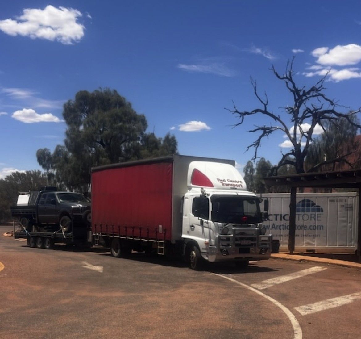Row of parked scooters in various colors, showcasing front wheels and fenders. โ Red Centre Transport in Braitling, NT