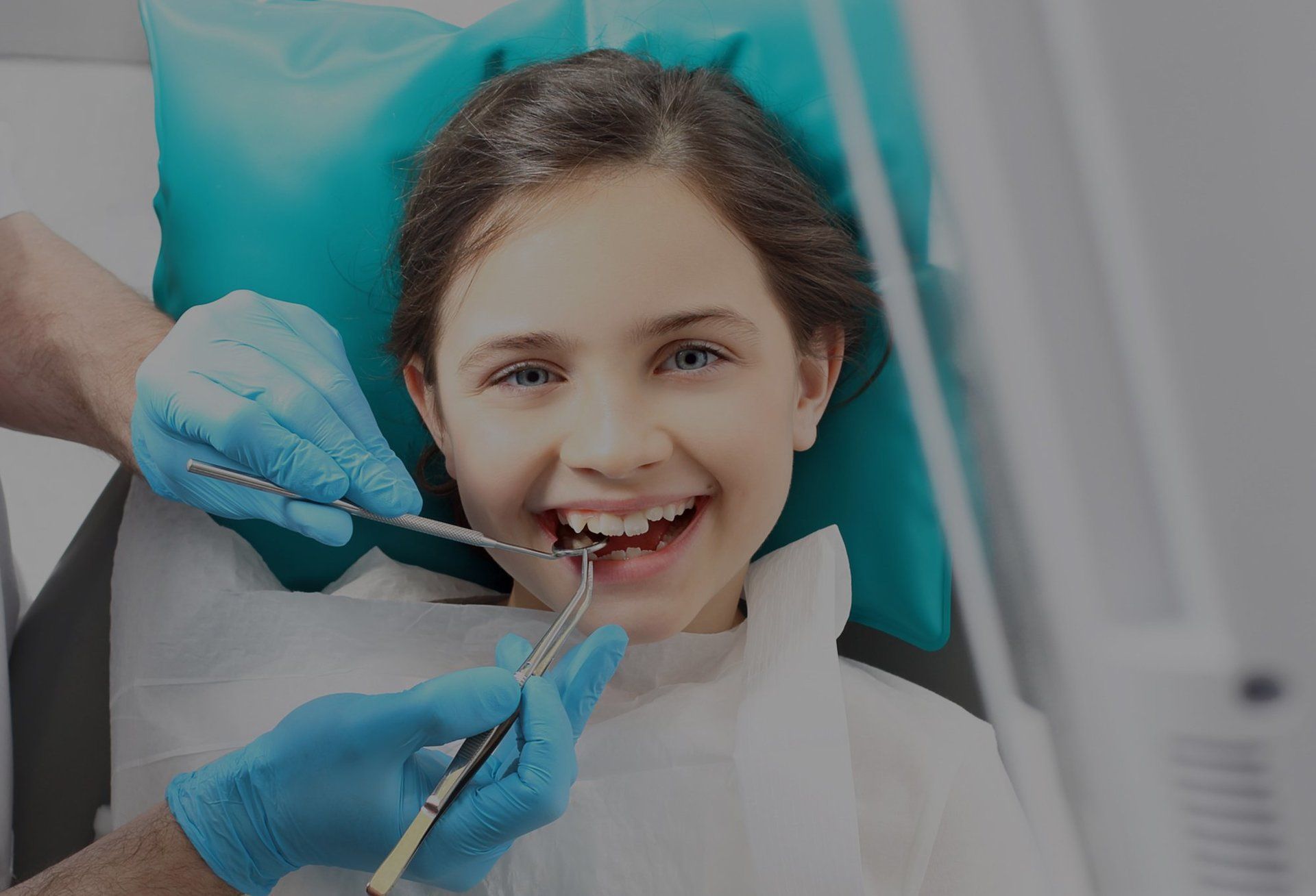 Smiling child receiving a dental checkup
