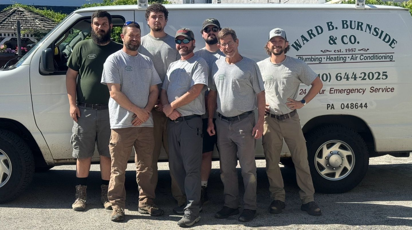 Employees standing in front of a the company van - Plumbing in Berwyn, PA Employees standing in front of a the company van - Plumbing in Berwyn, PA