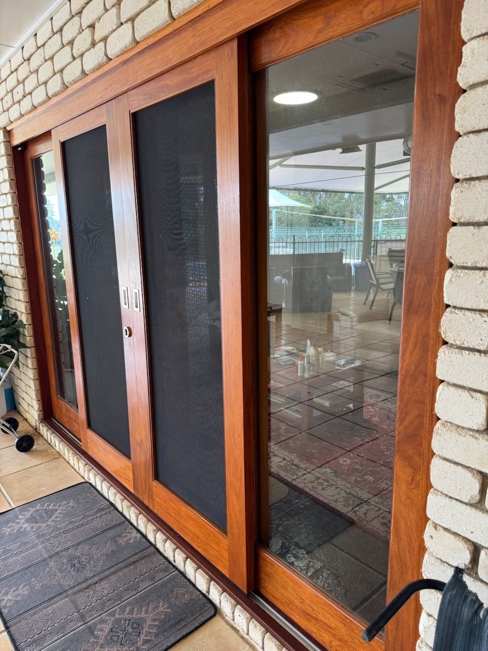 Wood-framed glass sliding doors — Painter In Sunshine Coast, QLD