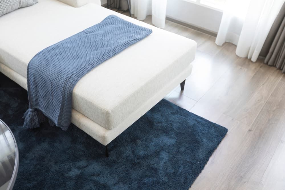 A Bedroom with A Bed and A Blue Rug — More on the Floor in Kiama, NSW