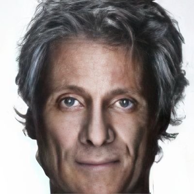 A close up of a man 's face with gray hair and blue eyes.