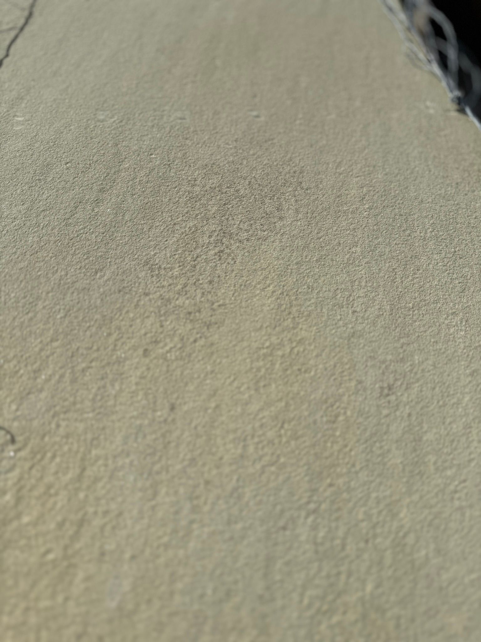 A close up of a piece of sand on a beach.